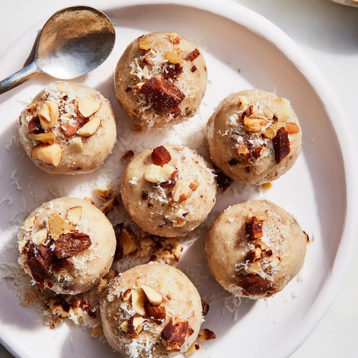 Rich and creamy vegan Thanksgiving macadamia dessert bites on a rustic plate.