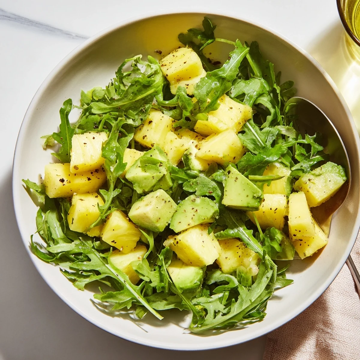 Chilled Pineapple Avocado Summer Salad, a refreshing vegan dish for warm days.
