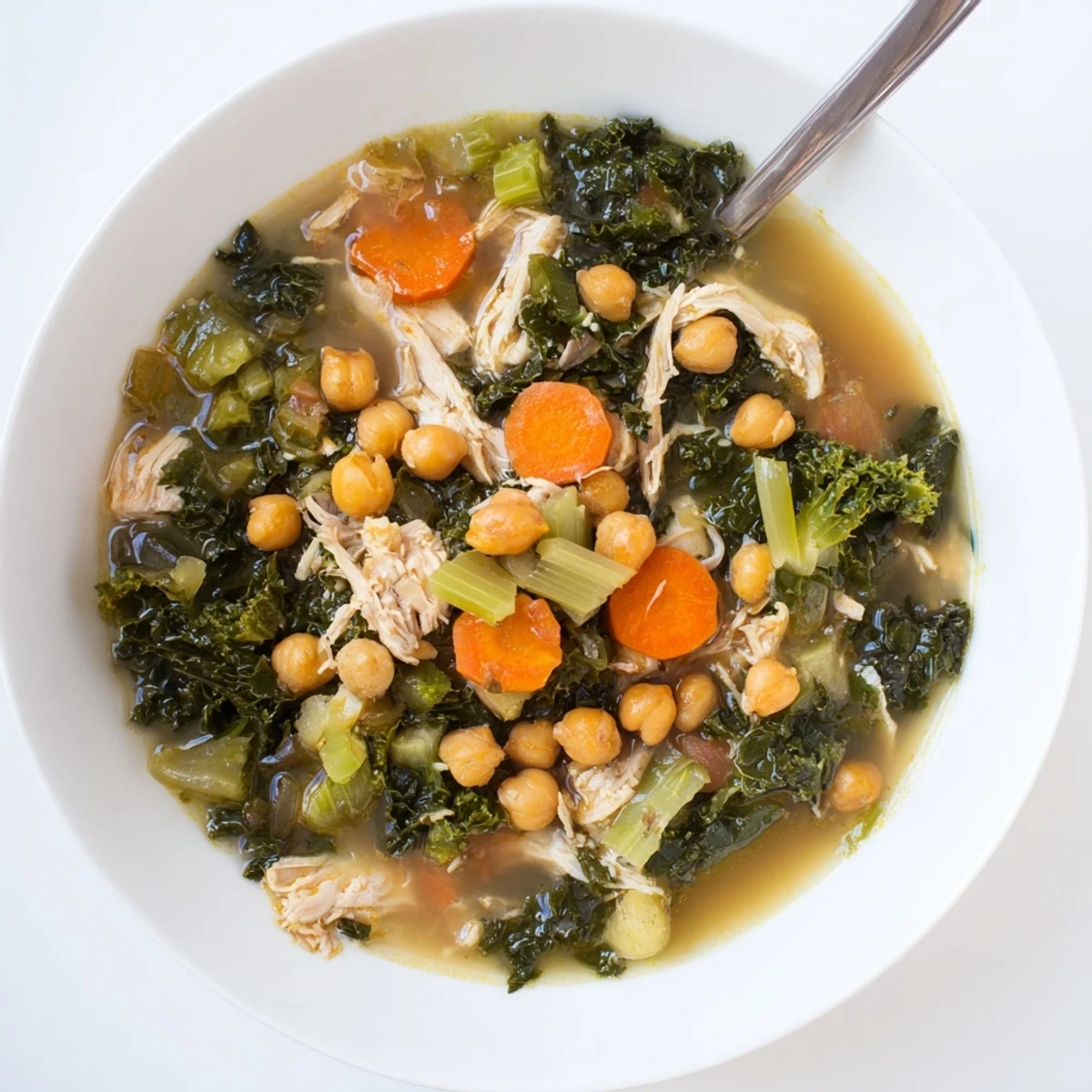 Imagine a vibrant bowl of Chicken Kale Soup with Crispy Chickpeas, overflowing with tender chicken and kale.