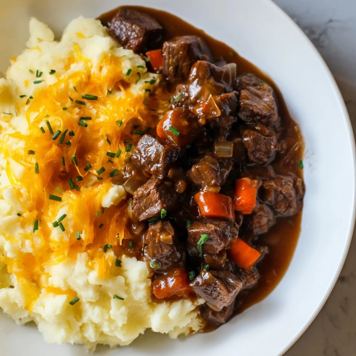Hearty Fall Apple Cider Stew Mash with tender beef, a savory aroma, and fresh chive garnish.