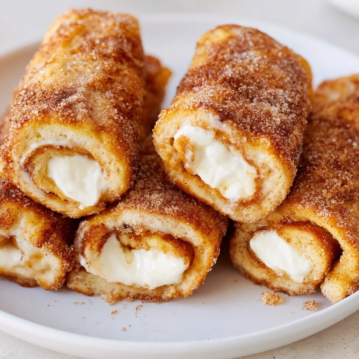 A close-up of Easy French Toast Roll-Ups, showing a beautiful cinnamon sugar crust and perfect texture.