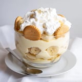 Classic southern Banana Pudding in a clear trifle bowl, revealing layers of pudding and wafers.
