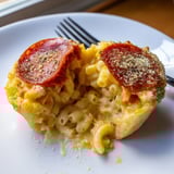 Close-up of homemade Cheesy Pepperoni Mac Bombs: golden crust, bubbling cheese, savory aroma.