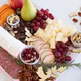 Twelve Days of Christmas Snack Board, filled with cheeses, fruits, and treats for festive sharing.