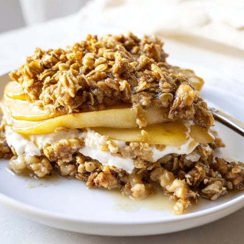 Golden Ricotta Apple Granola Crisp bubbling in baking dish, ready for a comforting dessert.
