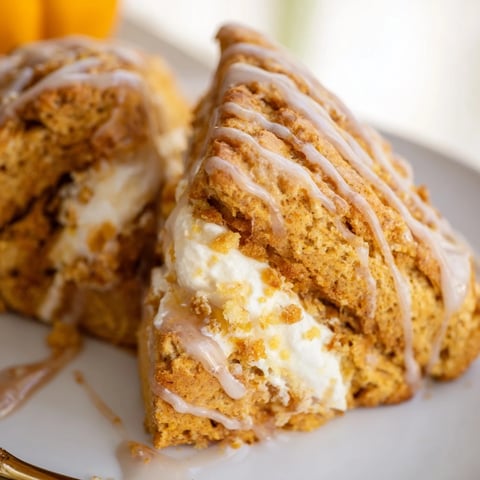 Delicious Chai Pumpkin Sweet Tea Cheesecake Cake Scones topped with a sweet tea glaze.
