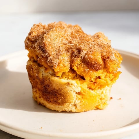 Tender cinnamon sugar maple bourbon flaky sweet potato biscuit muffins, perfect for brunch enjoyment.  