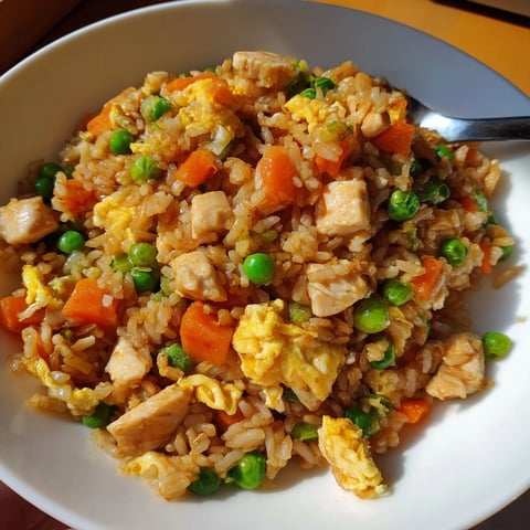 Savory Easy Chicken Fried Rice with vibrant veggies and scrambled eggs ready to enjoy.  