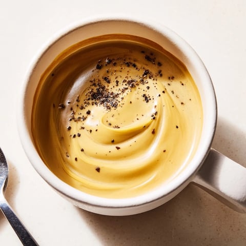 Creamy Onion Latte topped with frothy milk and caramelized onion sweetness.  