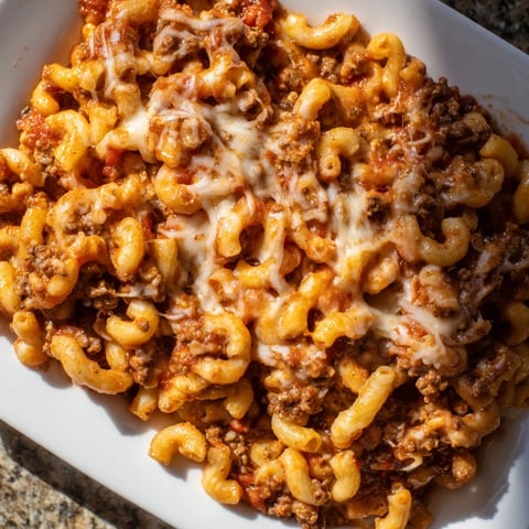 Golden, bubbly baked hamburger casserole with melted cheese, a classic family-friendly meal.