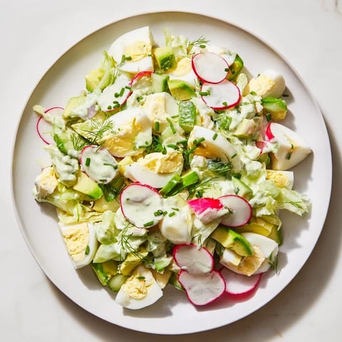 Vibrant Green Goddess Chopped Egg Salad with creamy dressing and fresh, crisp vegetables, ready to enjoy.