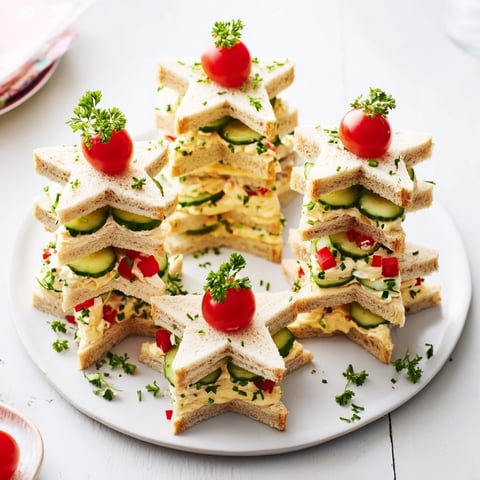 Stacked Star Christmas Tree Sandwiches: Festive, layered sandwiches with colorful fillings, perfect for holiday appetizers.