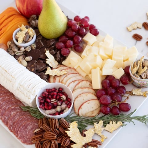 Twelve Days of Christmas Snack Board, filled with cheeses, fruits, and treats for festive sharing.