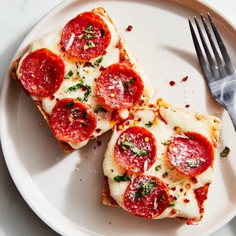 Warm, melted mozzarella atop crisp pepperoni and crackers in these savory bites.