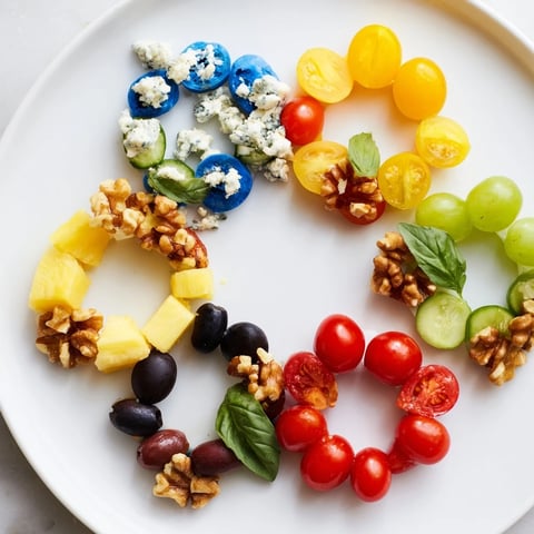 Vibrant Olympic Rings appetizer platter with a colorful medley of fresh ingredients, artfully arranged.