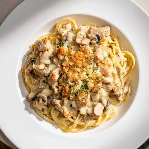 Golden and bubbly Turkey Tetrazzini with a creamy sauce and crunchy panko topping, ready to serve.