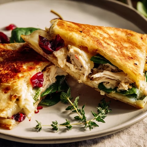 Chicken and Brie Holiday Wrap, melty brie and shredded chicken nestled in a toasted tortilla.