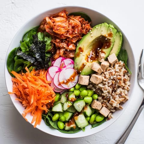 Delicious fermented vegetable bowl with kimchi, grains, and vibrant seasonal ingredients.  