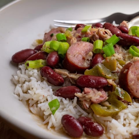 Comforting red beans & rice dish featuring tender beans and aromatic vegetables.  