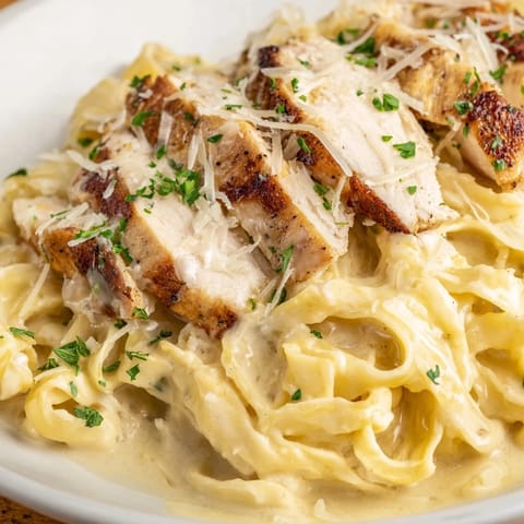 Sizzling Cajun Chicken Alfredo with tender chicken and fettuccine, a flavorful, homemade meal.