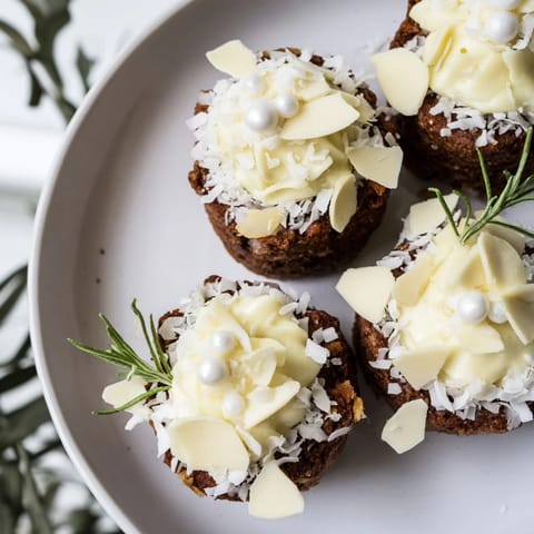 Snowy white chocolate mousse blankets the Table dHiver Sapin et Flocons' pistachio-almond sponge cake.