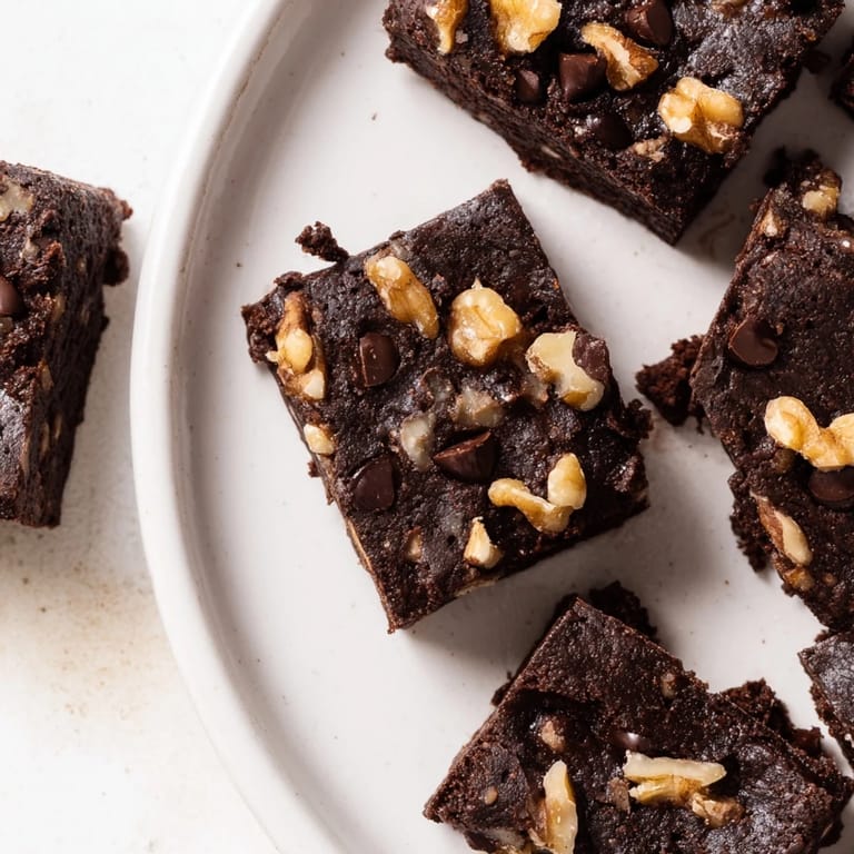 Delicious zero-waste brownies with dark chocolate chips and nut-milk pulp for guilt-free enjoyment.