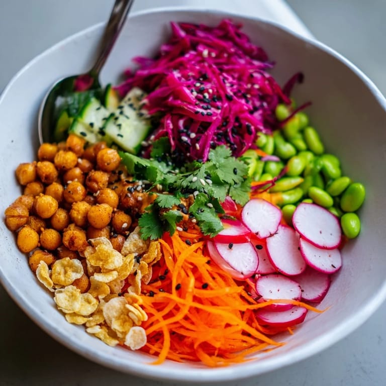Savor the textures of ASMR Crunch Snack Bowls, topped with roasted chickpeas and pumpkin seeds.