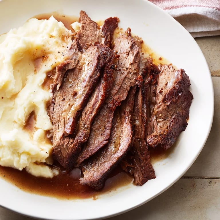 Savor the aroma: succulent Classic Brisket & sweet potato mash, a warming, comforting dinner dish.