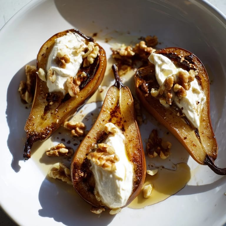 Close-up of baked roasted pears with cinnamon, walnuts, and Greek yogurt—a beautiful, healthy dessert in bowls.