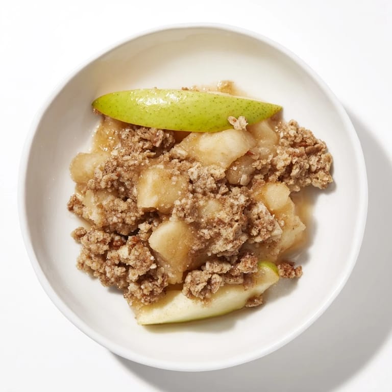 Golden brown, bubbly Best Apple Crisp with a crispy oat topping, perfect for a cozy dessert.