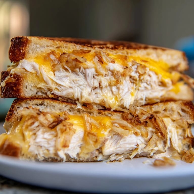 Savory Crispy Shallot Chicken Grilled Cheese, showcasing tender chicken and crispy shallots; a perfect comfort food.