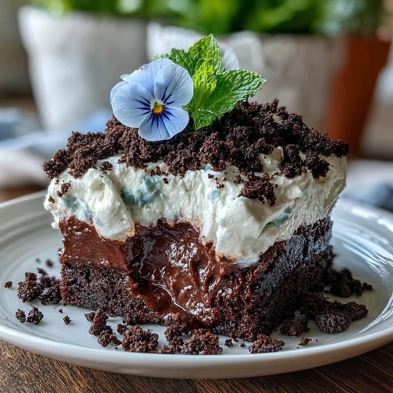 Sweet Mother's Day Flower Pot Brownies with Oreo Dirt topped with edible flowers.