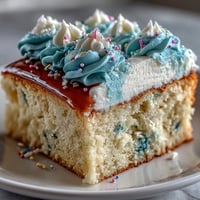 Moist vanilla sheet cake with creamy buttercream and Class of 2026 piping, perfect for graduation celebrations.